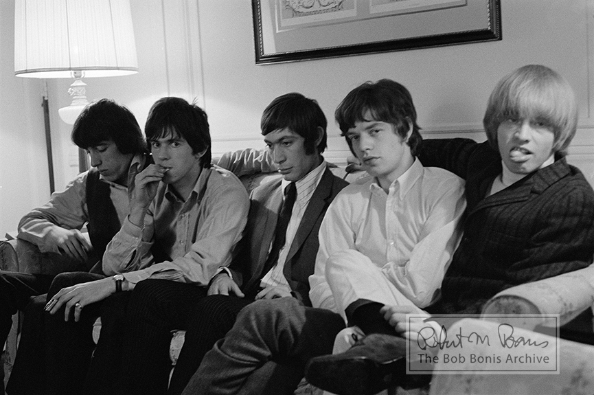 Mike Jagger, Keith Richards, Brian Jones of The Rolling Stones wait for a press party at a hotel in New York in 1965. Photo by Bob Bonis